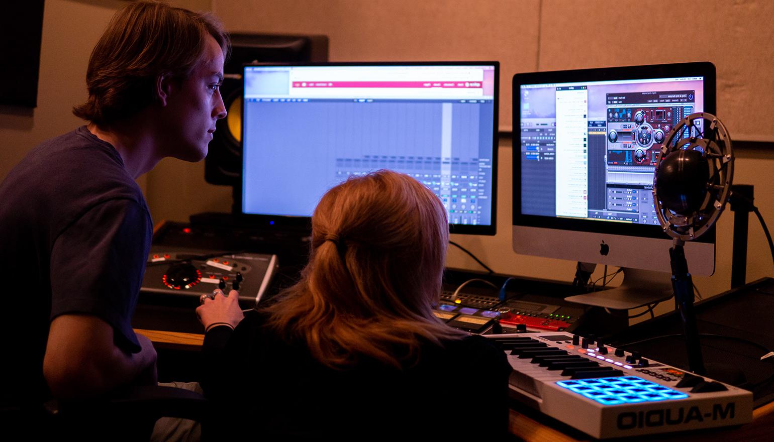 Two students looking at screen